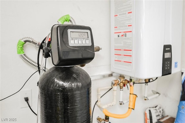 utility room featuring water heater