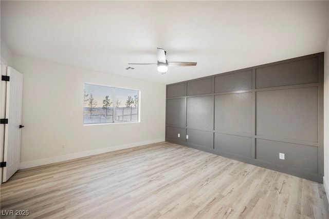 unfurnished bedroom with ceiling fan and light hardwood / wood-style floors