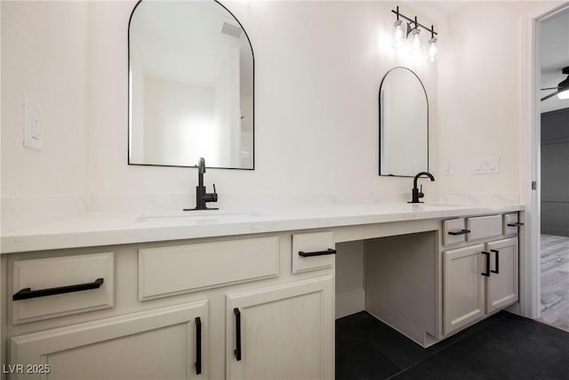 bathroom featuring ceiling fan and vanity