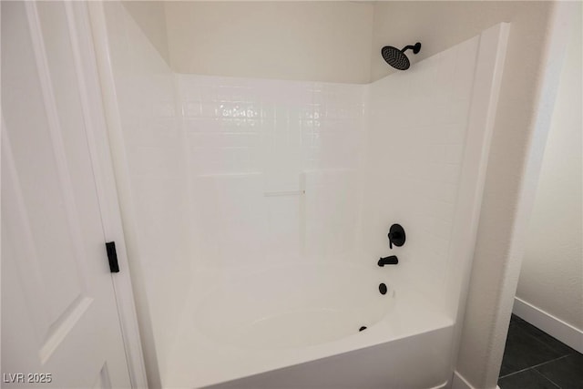 bathroom featuring shower / bathing tub combination and tile patterned floors