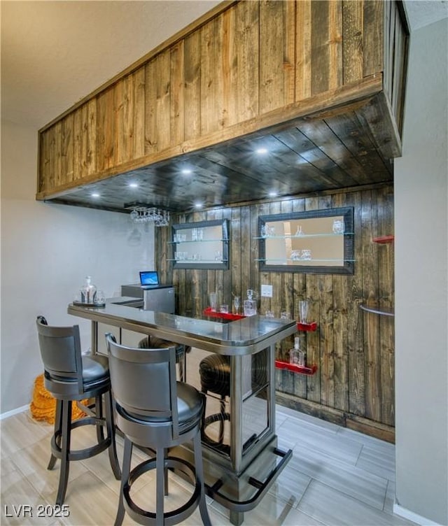 bar featuring wooden walls