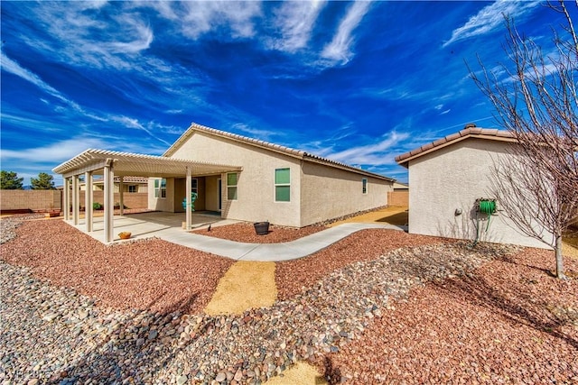 back of property with a patio and a pergola