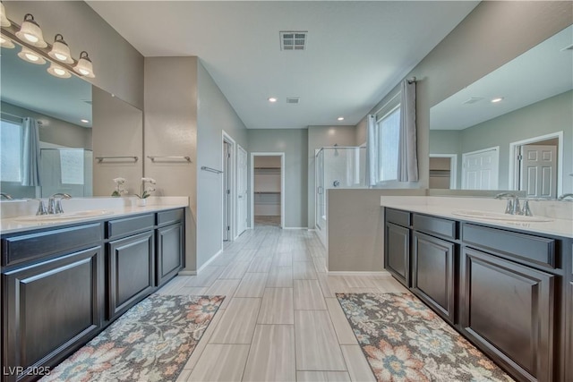 bathroom with vanity and an enclosed shower