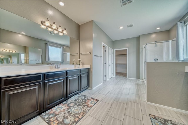 bathroom with vanity and walk in shower