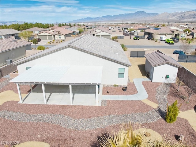 birds eye view of property with a mountain view