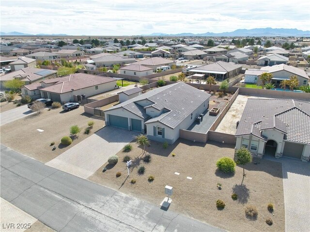 birds eye view of property with a mountain view