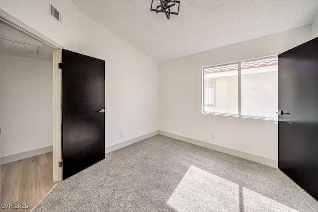 unfurnished bedroom featuring carpet floors, a textured ceiling, and a closet