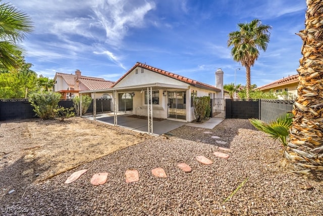 back of property featuring a patio area