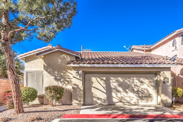 mediterranean / spanish-style house featuring a garage