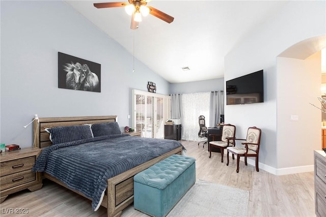 bedroom with ceiling fan, vaulted ceiling, and light hardwood / wood-style flooring