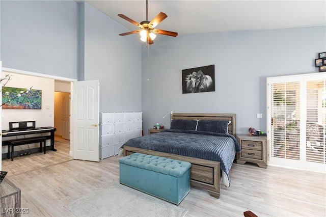 bedroom with high vaulted ceiling, light wood-type flooring, and ceiling fan