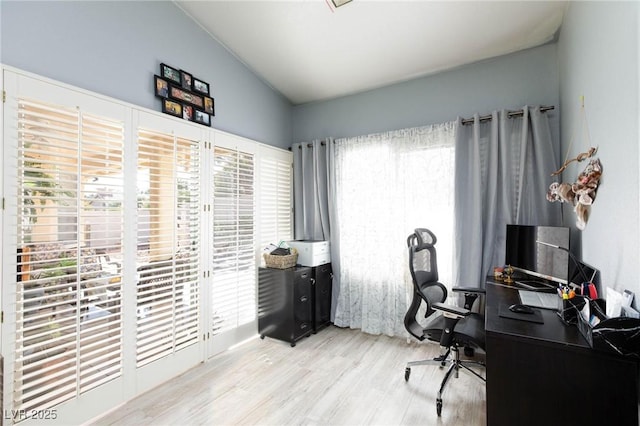 office area with lofted ceiling and light hardwood / wood-style floors