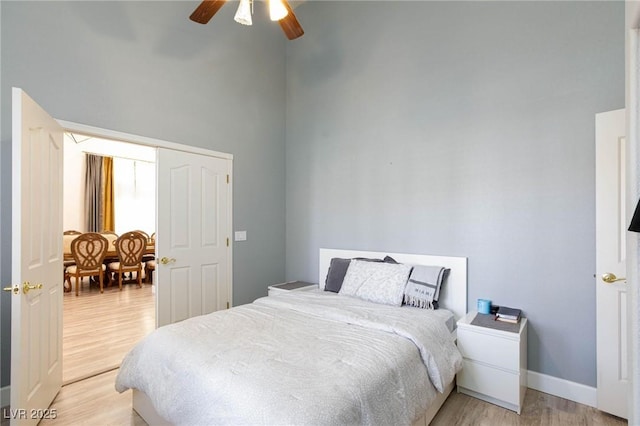 bedroom featuring ceiling fan and light hardwood / wood-style flooring