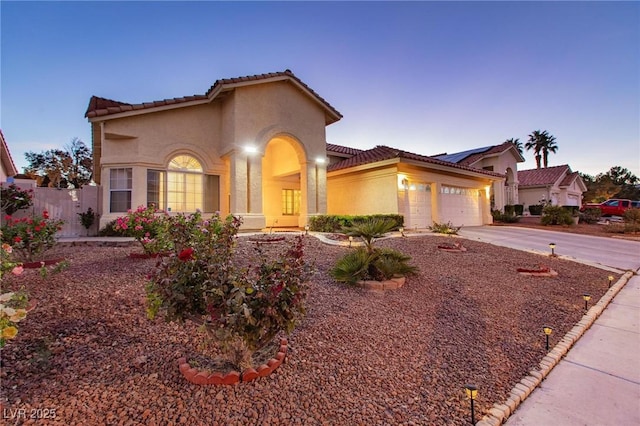 mediterranean / spanish-style house featuring a garage