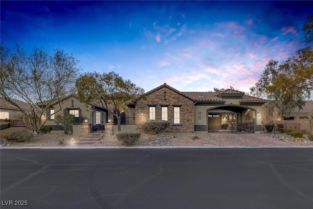 mediterranean / spanish-style house featuring a carport