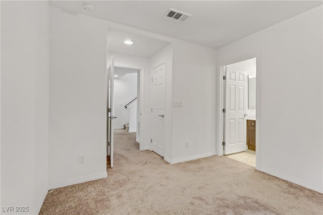 7075 Jasper Hill Way, Las Vegas, NV 89118 - unfurnished bedroom with light carpet, baseboards, and ensuite bathroom