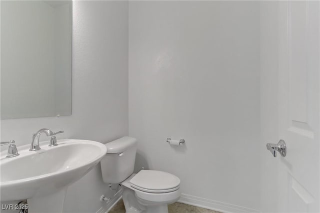 7075 Jasper Hill Way, Las Vegas, NV 89118 - half bath featuring a sink, toilet, and baseboards