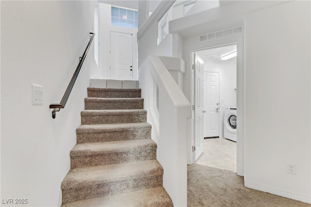 stairway with washer / dryer and carpet