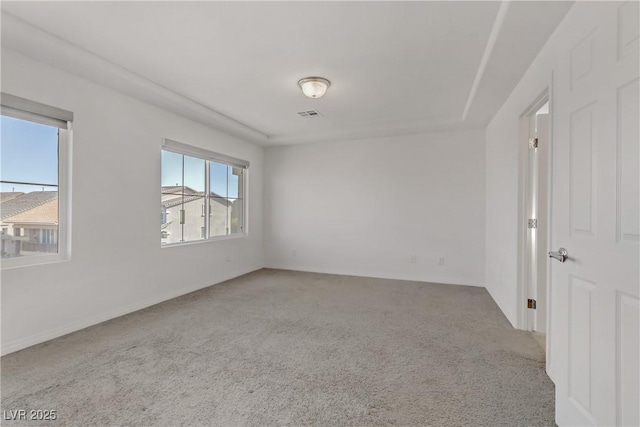 empty room featuring light colored carpet