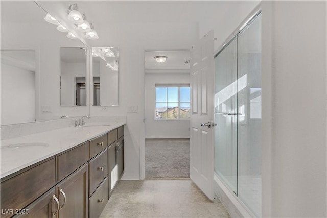 7075 Jasper Hill Way, Las Vegas, NV 89118 - bathroom with double vanity, a shower with door, baseboards, and tile patterned floors