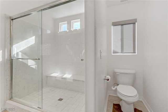 7075 Jasper Hill Way, Las Vegas, NV 89118 - full bath featuring toilet, a shower stall, baseboards, and tile patterned floors