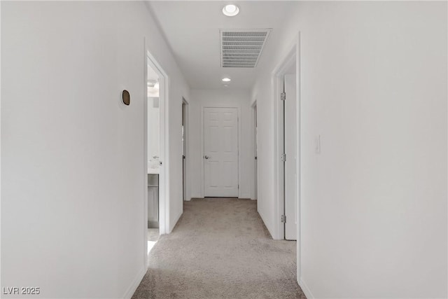 hallway with light carpet