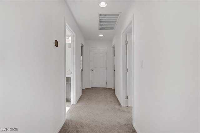 7075 Jasper Hill Way, Las Vegas, NV 89118 - corridor with light carpet, baseboards, and recessed lighting