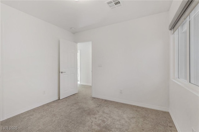 spare room with light carpet and a healthy amount of sunlight