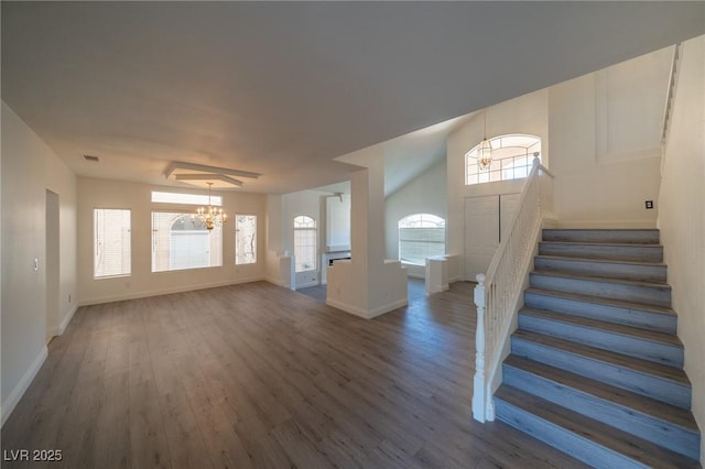 foyer featuring hardwood / wood-style flooring and a notable chandelier