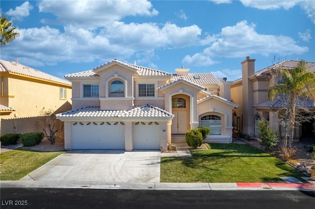 mediterranean / spanish house with a garage and a front yard