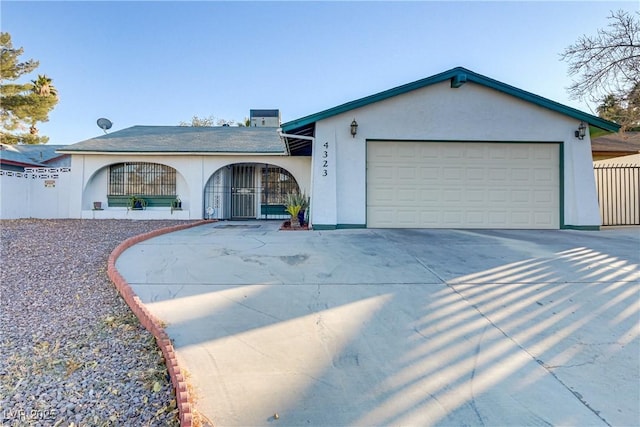 ranch-style house featuring a garage