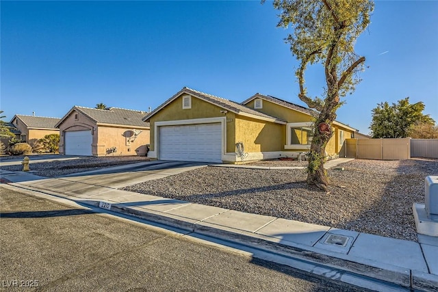 single story home featuring a garage