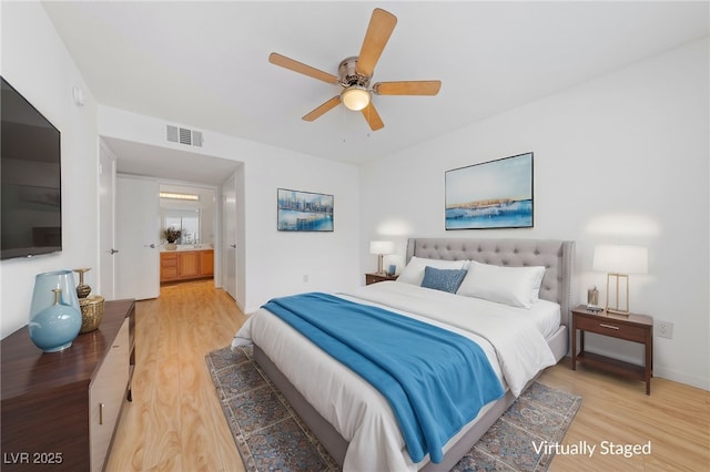 bedroom with ceiling fan and wood-type flooring