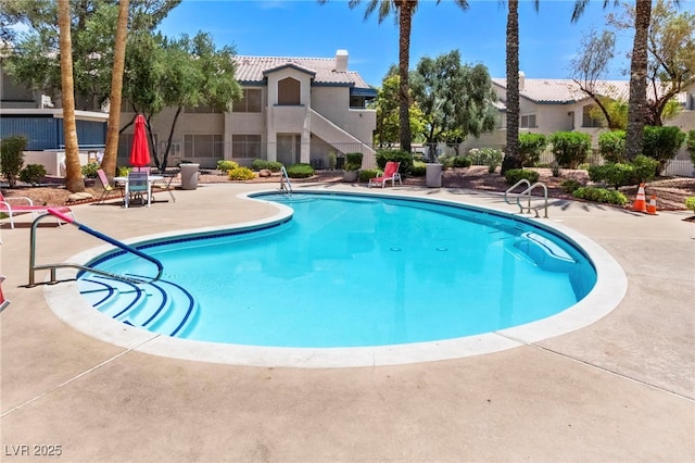 view of pool featuring a patio