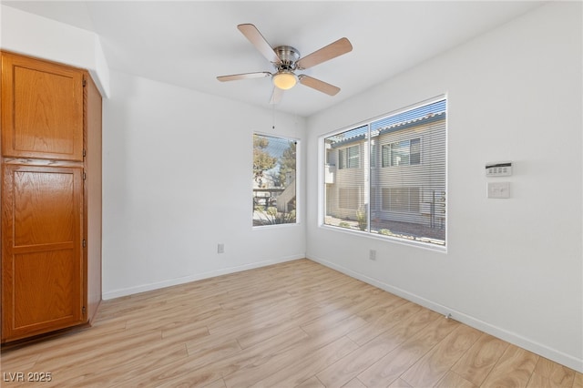 unfurnished room featuring ceiling fan and light hardwood / wood-style flooring