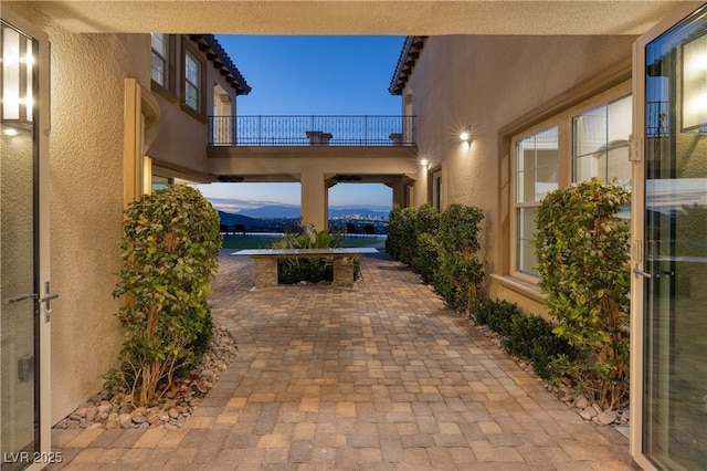 patio terrace at dusk with a mountain view