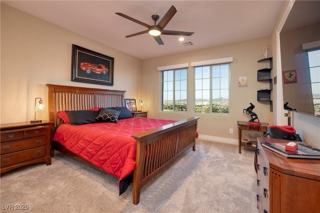 bedroom featuring light carpet and ceiling fan