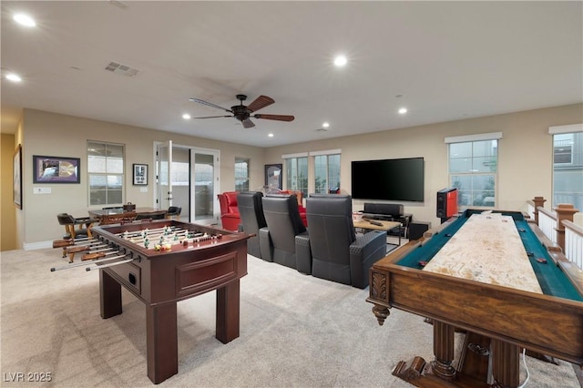 game room with ceiling fan and light colored carpet