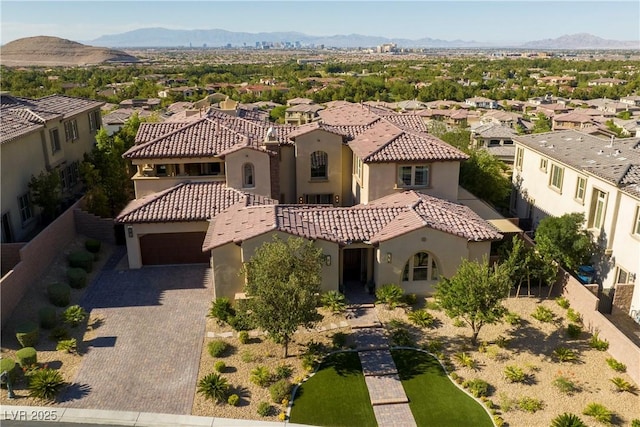 view of front of property with a mountain view and a garage