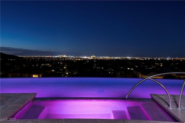 view of pool at night