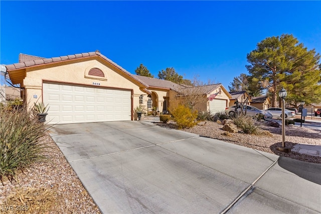 single story home with a garage