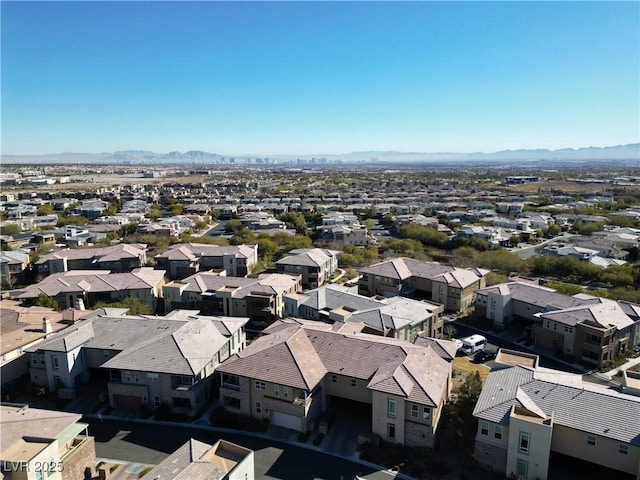 birds eye view of property with a mountain view