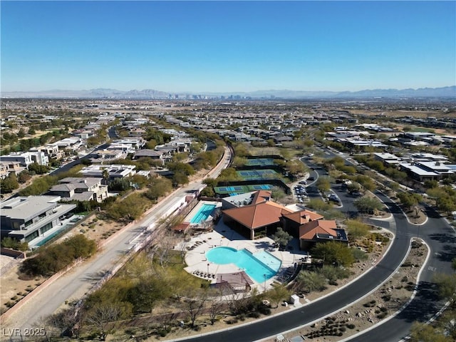 birds eye view of property with a mountain view