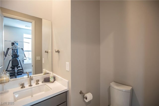 bathroom with vanity and toilet