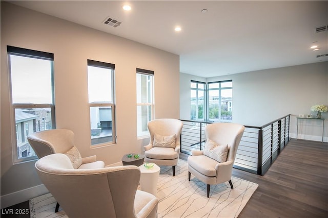 sitting room featuring dark hardwood / wood-style floors