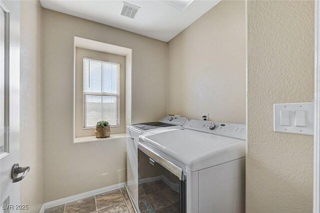 washroom featuring washing machine and dryer