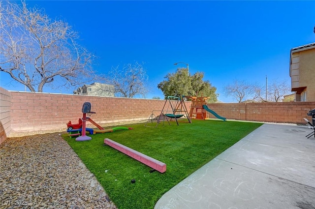 view of yard with a playground and a patio