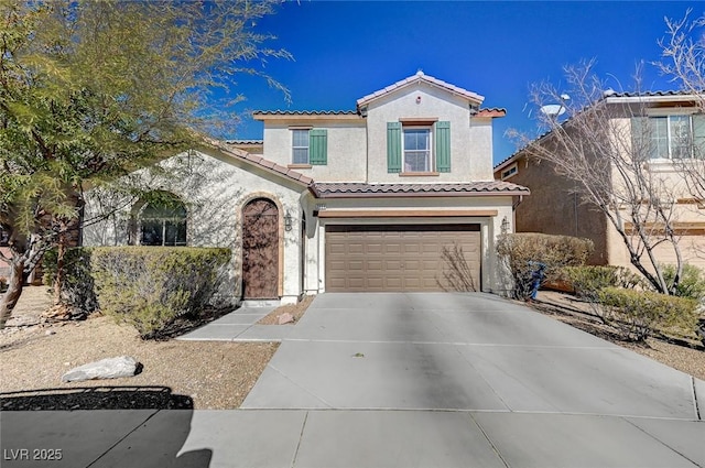 mediterranean / spanish-style home with a garage