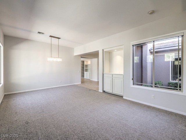 empty room featuring carpet flooring