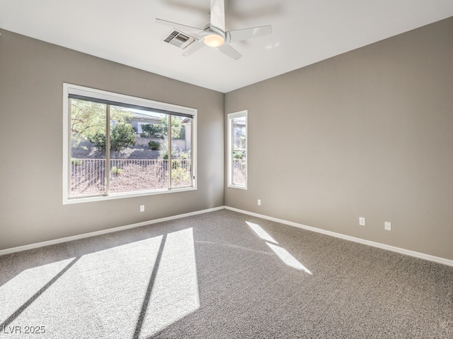 carpeted empty room featuring ceiling fan